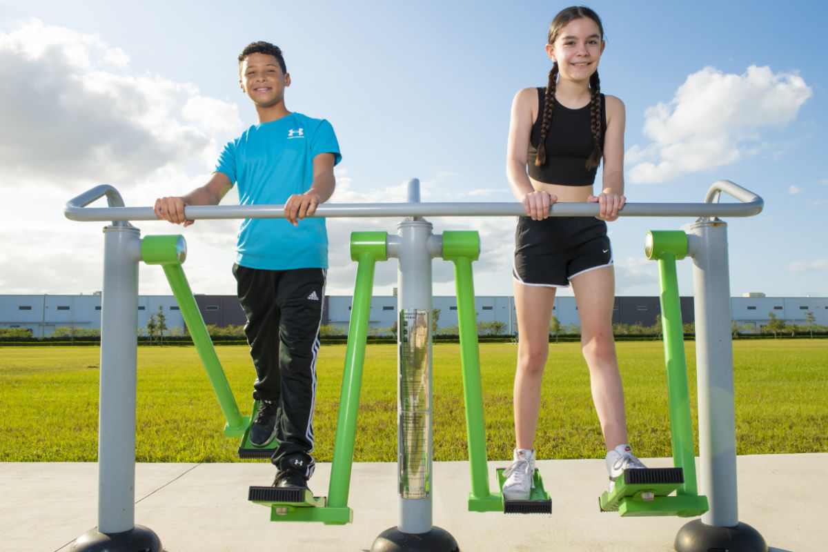 Young boy and young girl using ExoKids' 2-Person Air Walker.